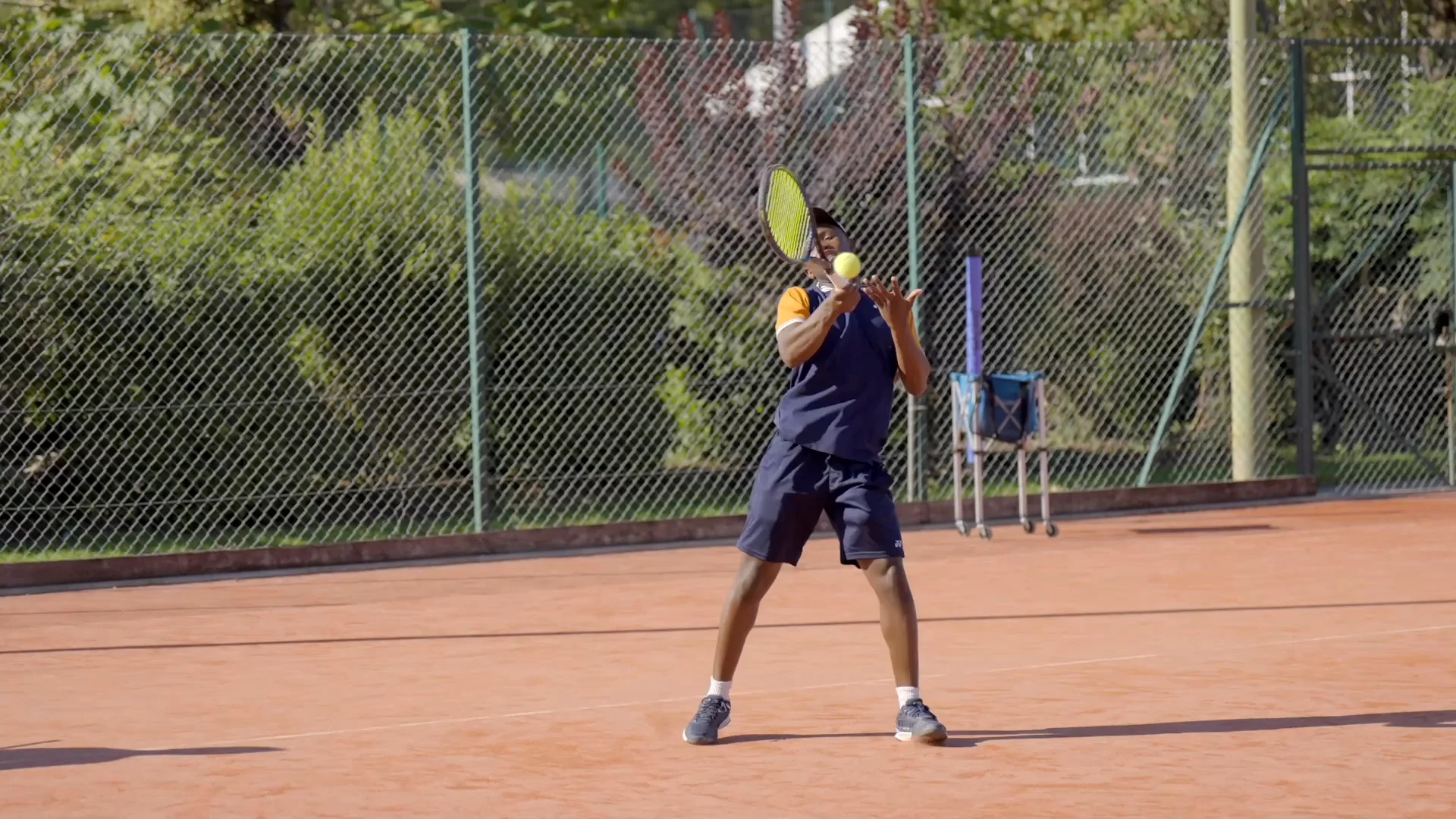 Develop heavy, rising ground strokes with spin and trajectory